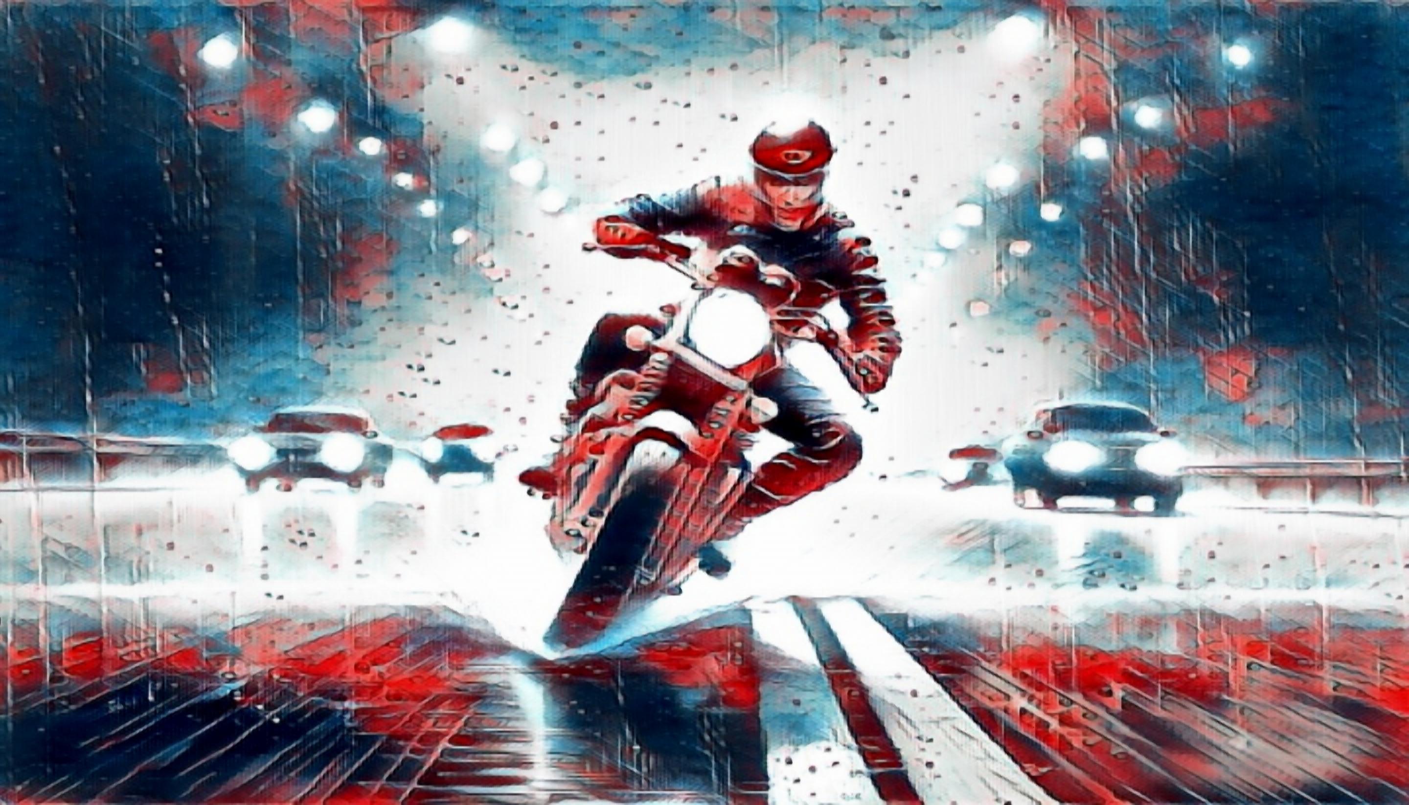 A biker attempting to regain control of their motorcycle while riding in the rain
